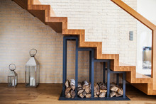 Modern Solution To Storage Pile Of Wood Under The Stairs At Home