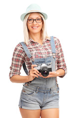 Poster - Blond hipster girl holding a camera