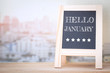 © sitthiphong - Concept HELLO JANUARY message on wood boards