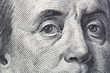 Close view of Benjamin Franklin on the front of a US hundred dollar bill.