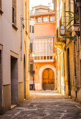 Fototapete - Narrow street of a old town 
