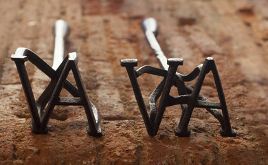 two rustic branding irons for cattle