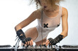 Girl with headphones and a sexy outfit, playing music mixer
