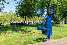 Running Man With Violin Case Statuet