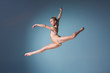 © master1305 - Young beautiful modern style dancer jumping on a studio background
