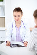 © rogerphoto - Young female doctor listen to patient story carefully. Medical  and Health care concept.