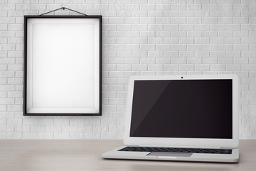 Poster - Modern Laptop in front of Brick Wall with Blank Frame
