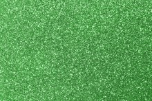 Background Shining Uniformly Colored Green Glitter