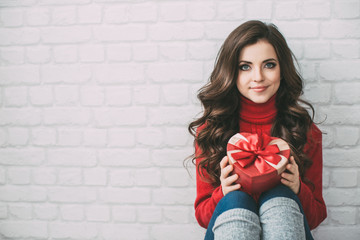 Wall Mural - Cute woman with a gift heart.