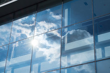 Sun Ray And Blue Sky Reflection On Window Office Building, Busin
