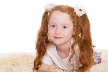 Little beautiful girl with red hair