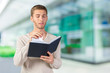 © fotofabrika - Handsome young business man reading a book