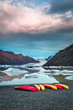 Kayaks at glacial lake in the mountains, Iceland