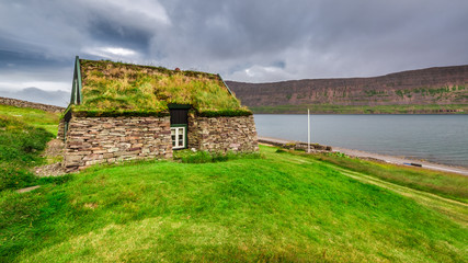 Wall Mural - Cottage covered with grass on the roof in Iceland