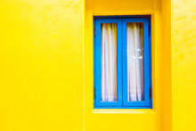 Blue Window On Yellow Wall