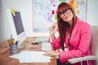 © WavebreakMediaMicro - Smiling hipster businesswoman at her desk