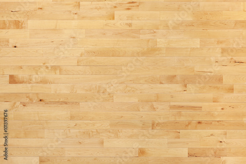 Hardwood basketball court floor viewed from above
