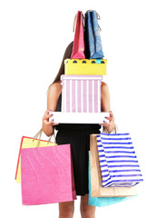 Wall Mural - Beautiful young woman with shopping bags and boxes isolated on white