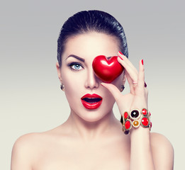 Fashion woman with red heart. Valentine's day art portrait