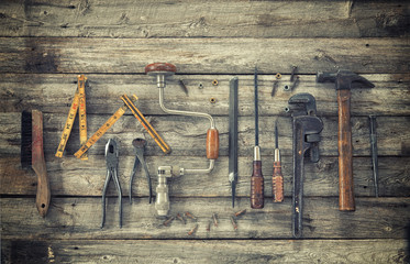 Sticker - Old tools viewed from above on rough wood surface