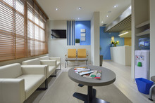 Interior Of A Modern Waiting Room. Clinical With Empty Chairs