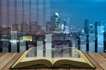 open book with technical graph on night cityscape background