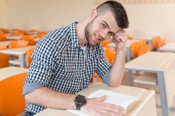 Wall Mural - Student With Books Sitting In Classroom