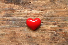 Small Red Heart On Wooden Table