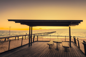 Wall Mural - Picnic table at Port Noarlung during sunset