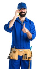 Wall Mural - Plumber talking to mobile