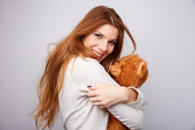 Red-haired Woman With A Teddy Bear