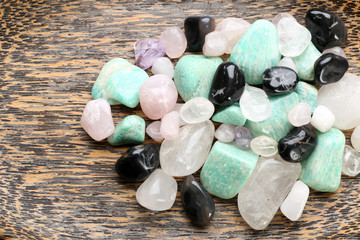 Poster - Semiprecious stones on wooden background