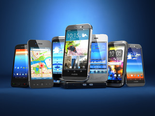 Leinwandbilder - Choose mobile phone. Row of the different smartphones on blue ba
