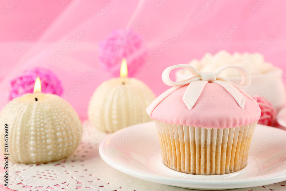Tasty cupcake with candles and decorations, closeup