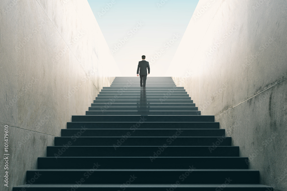 Ambitions concept with businessman climbing stairs - obrazy, fototapety, plakaty 