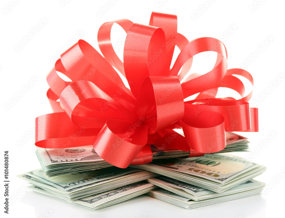 Dollars and big red bow isolated on white