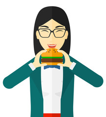 Canvas Print - Woman eating hamburger. 