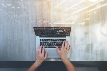 Poster - Designer hand working with laptop computer on wooden desk as res