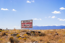 Sign Pointing To Four Corners Monument In USA