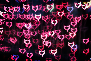 Wall Mural - Blurring lights bokeh background of Devil hearts