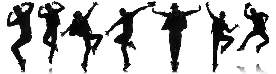 Wall Mural - Silhouettes of dancers in dancing concept