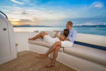 Romantic Vacation . Beautiful Couple Looking In Sunset From The Yacht