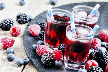 Wall Mural - Ice berry tea with raspberries, blackberries and blueberries, se