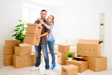 Poster - moving to a new apartment. Happy family couple and cardboard box