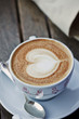 cup of hot coffee , cappuccino heart design