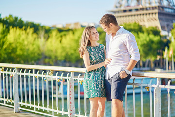 Wall Mural - Young romantic couple spending their vacation in Paris