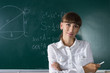 © skumer - Young teacher woman or student at the blackboard