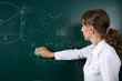 © skumer - Young teacher woman or student at the blackboard