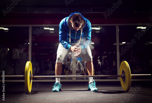 Fotografie, Obraz Cross fit weightlifter preparing for training