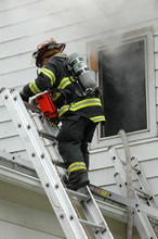 Firefighter Climbing Ladder